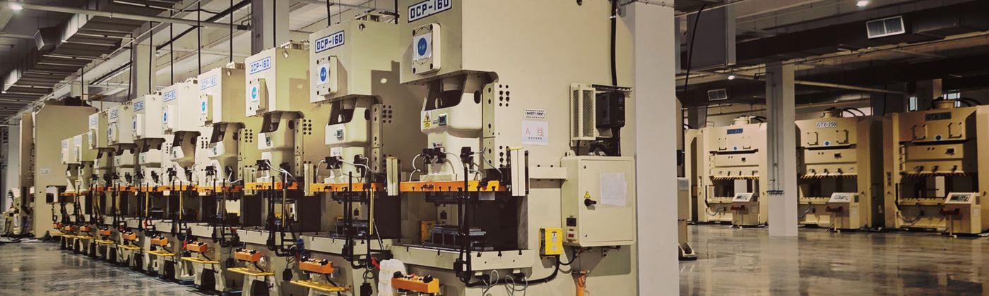 Industrial factory floor with rows of production machinery and automated equipment